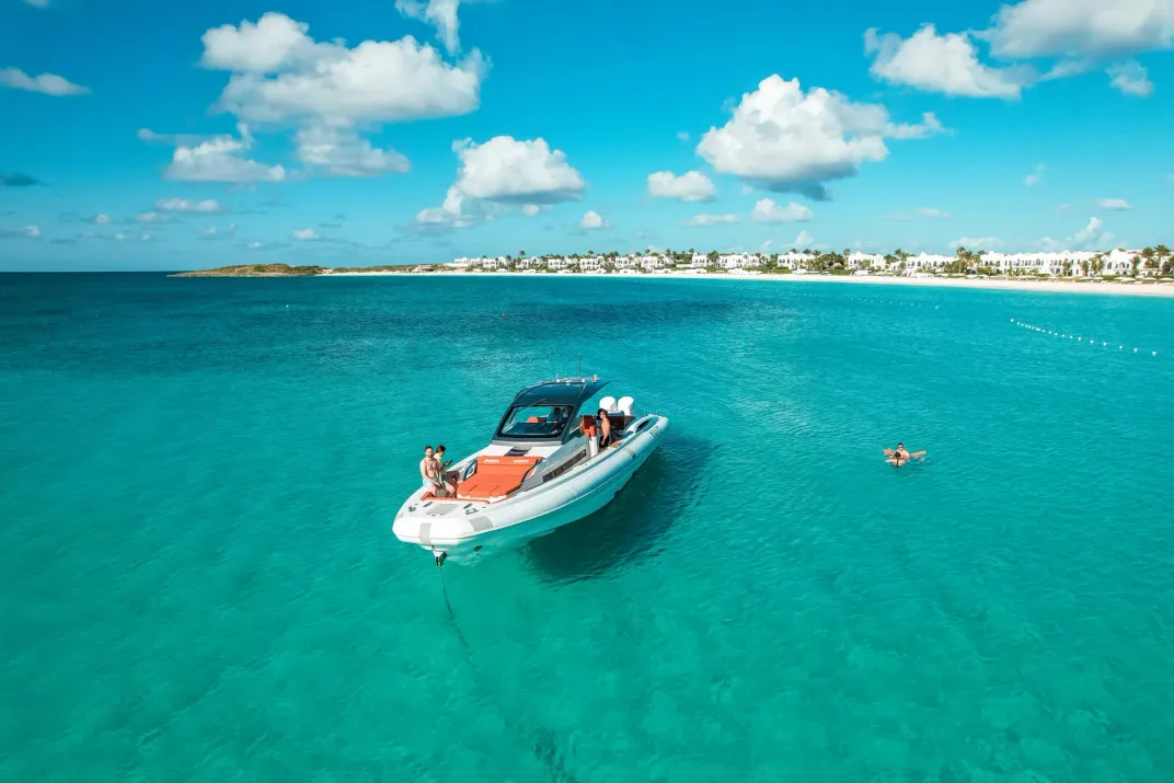Private charter boat anchored in turquoise water off St Barth